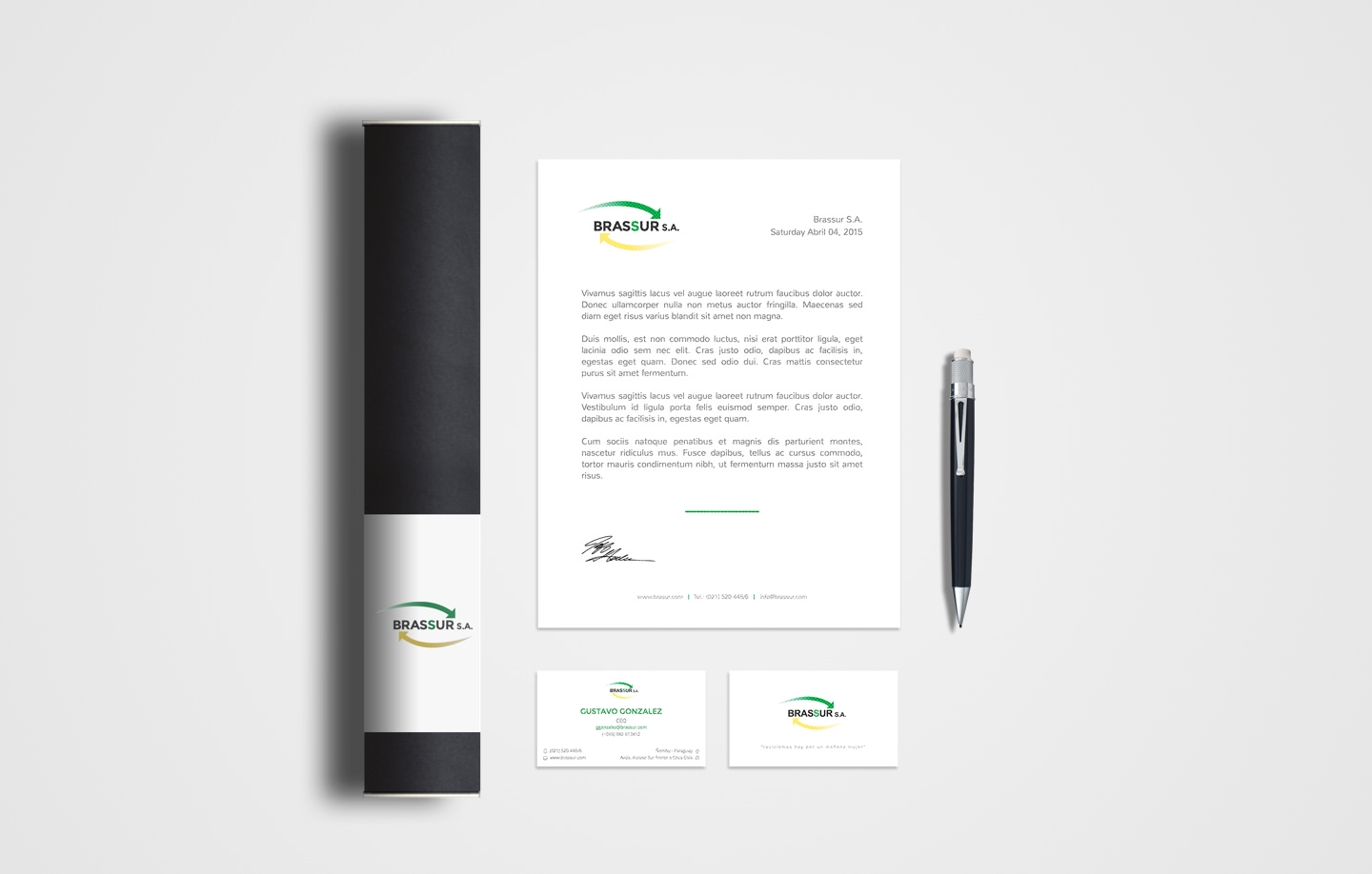 Brassur S.A. stationery — letterhead, business cards, and pen on grey surface